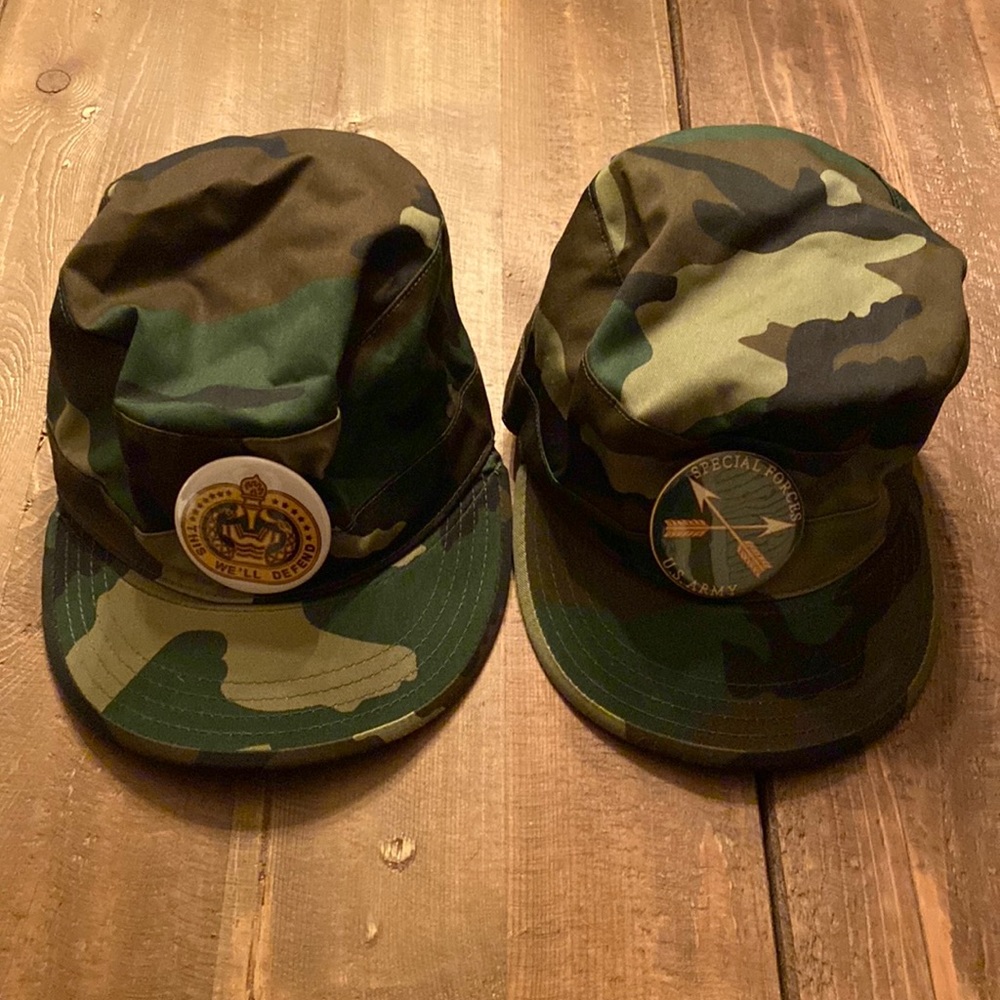 Two costume military caps with pins
